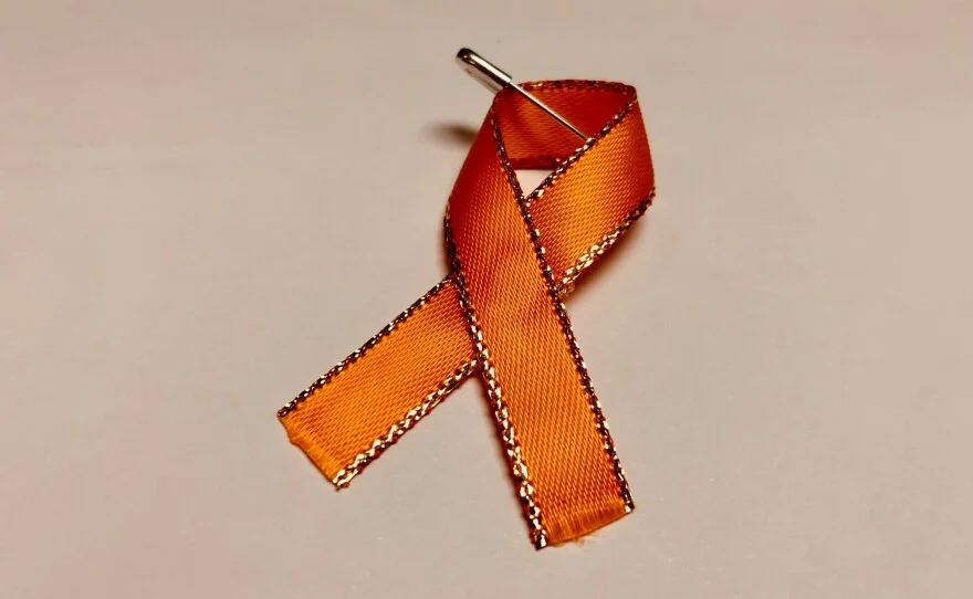 a pinned orange ribbon